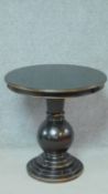 A lacquered ebonised and gilt circular pedestal occasional table on stepped base. H.66 W.66 D.66cm