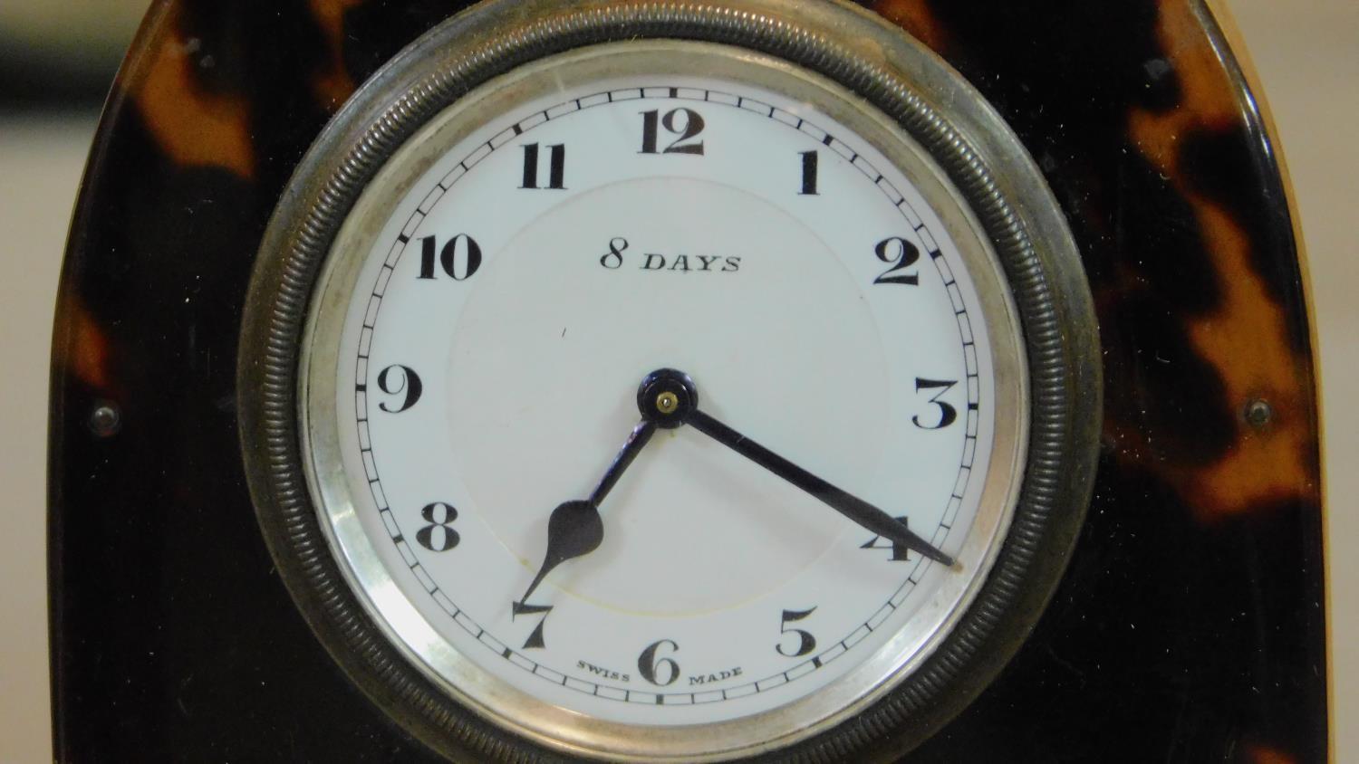 A tortoiseshell cased lancet shaped mantel clock with white metal swag inlay. Swiss made movement. - Image 3 of 7