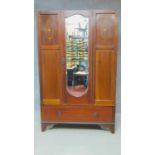 An Edwardian mahogany and satinwood inlaid wardrobe. H.187 W.117 D.45cm