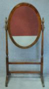 An early 20th century Regency style mahogany cheval mirror on swept stretchered supports. H.137cm