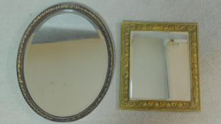 A gilt framed wall mirror and an oval framed mirror. 56x45cm