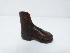 An antique apprentice made World War I replica boot made of leather and nails with stitched