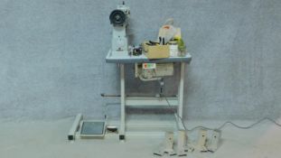 A Durkopp Adler 069 373 industrial sewing machine on stand. H.81 W.107 D.50cm