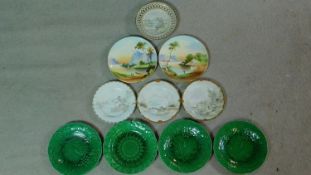 A collection of antique plates. Including four green glazed majolica plates, three with vine