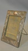 An Edwardian Art Nouveau design silver easel frame hallmarked: J&RG for J & R Griffin (Joseph &