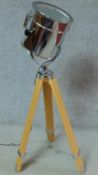 A vintage style chrome spotlight on adjustable tripod base. H.115cm