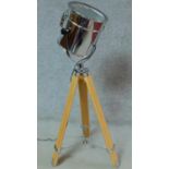 A vintage style chrome spotlight on adjustable tripod base. H.115cm