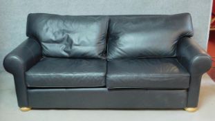 A contemporary charcoal leather upholstered two seater sofa by Multiyork. H.80 W.200 D.100cm