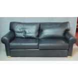 A contemporary charcoal leather upholstered two seater sofa by Multiyork. H.80 W.200 D.100cm