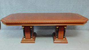 A Continental gilt and lacquered dining table with twin pillar Corinthian column supports. H.78 W.