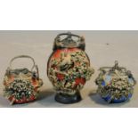 Three 20th century Chinese moulded painted resin stone effect urn and two small teapots. Decorated