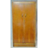 A mid 20th century oak Art Deco wardrobe fitted with drawers and shelves. H.178 W.91 D.43cm