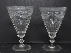 A pair of hand engraved blown glass Georgian rummers. Radiating design to the foot and rim of