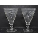 A pair of hand engraved blown glass Georgian rummers. Radiating design to the foot and rim of