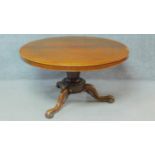 A Victorian mahogany tilt top dining table on tripod carved cabriole supports. H.68 W.122 D.122cm