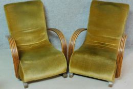 A pair of mid 20th century beech framed Art Deco style armchairs in velour upholstery on block feet.