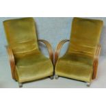 A pair of mid 20th century beech framed Art Deco style armchairs in velour upholstery on block feet.