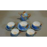 A hand painted vintage Japanese Lithophane tea set. The five cups have pictures of Geishas when held