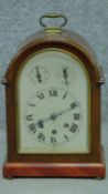 An antique Wurtemburg Westminster chime mahogany cased bracket clock. With brass carrying handle and