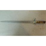 An antique wooden handled sword. W.55cm