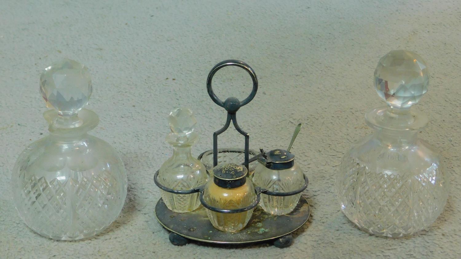 A collection of cut glass items. Including two antique diamond cut crystal perfume bottles with
