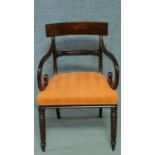 A William IV mahogany bar back armchair in tangerine stripe fabric painted upholstery with scroll