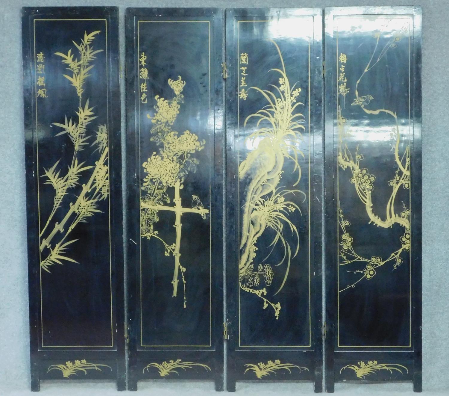 A Japanese black lacquered three fold and four panel screen with mother of pearl and bone inlay. - Image 14 of 23