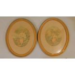 A pair of Victorian framed and glazed coloured lithographs on silk of couples. 57x47cm