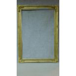 A large full height floral decorated giltwood and gesso picture or mirror frame. 210x150cm