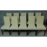 A set of ten contemporary calico upholstered dining chairs on square tapering supports. H.96cm