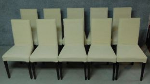 A set of ten contemporary calico upholstered dining chairs on square tapering supports. H.96cm