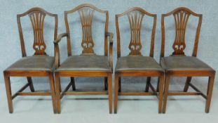 A set of four Georgian style mahogany dining chairs with leather drop in seats on square stretchered