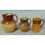 A collection of antique Doulton Lambeth stoneware. Including two stoneware glazed harvest jugs
