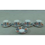 A Japanese floral design porcelain tea set, artist's signature to the base. Decorated with Camelia