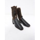 A pair of 18th century apprentice made black leather and brown suede heeled boots. Leather soles,