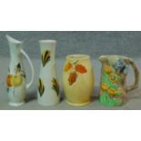 A collection of vintage hand painted Radford pottery pieces. One jug is Butterflyware with a moulded