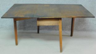 A 19th century mahogany drop flap dining table with gateleg action. H.70 W.153 D.103cm