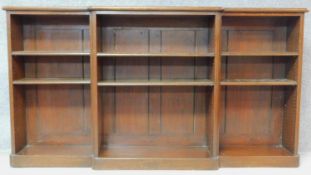 A 19th century oak breakfront dwarf open bookcase fitted with adjustable shelves on plinth base. H.