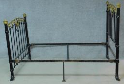 A Victorian brass and iron bedstead with inset cut glass panels, to take a 4ft 6in mattress.