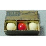 Three antique ivory billiard balls by W. Jelks & Sons Ltd of Holloway Road, London. In their