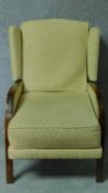 An early 20th century mahogany framed armchair in lemon upholstery. H.97cm