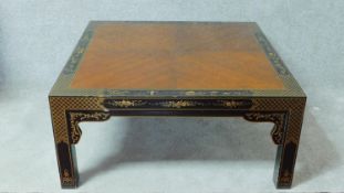 A vintage Drexel Et Cetera mahogany quarter veneered low table with Japan lacquered legs and