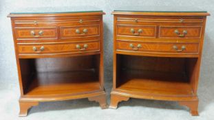 A pair of Georgian style flame mahogany and satinwood inlaid bedside cabinets fitted with brushing