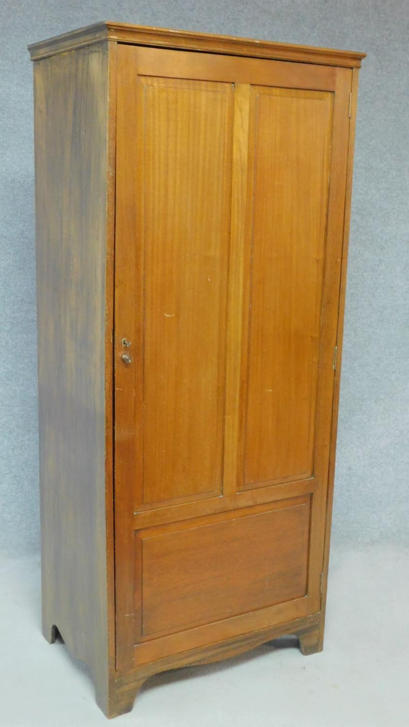 A vintage teak hall cupboard with panel door enclosing shelves on bracket feet. H.176 W.76 D.51cm - Image 2 of 5