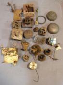 A collection of antique brass clock and watch mechnisms including strikers,bells, barrells and other