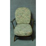 A vintage Ercol beech framed Windsor armchair with fauna & flora design fabric upholstered seat