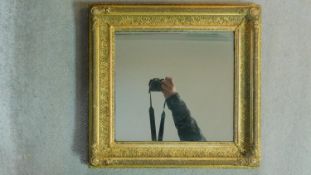 A 19th century giltwood and gesso wall mirror with original plate. 47x50cm