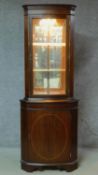 A Georgian style mahogany corner cabinet. H.181 W.67 D.45cm