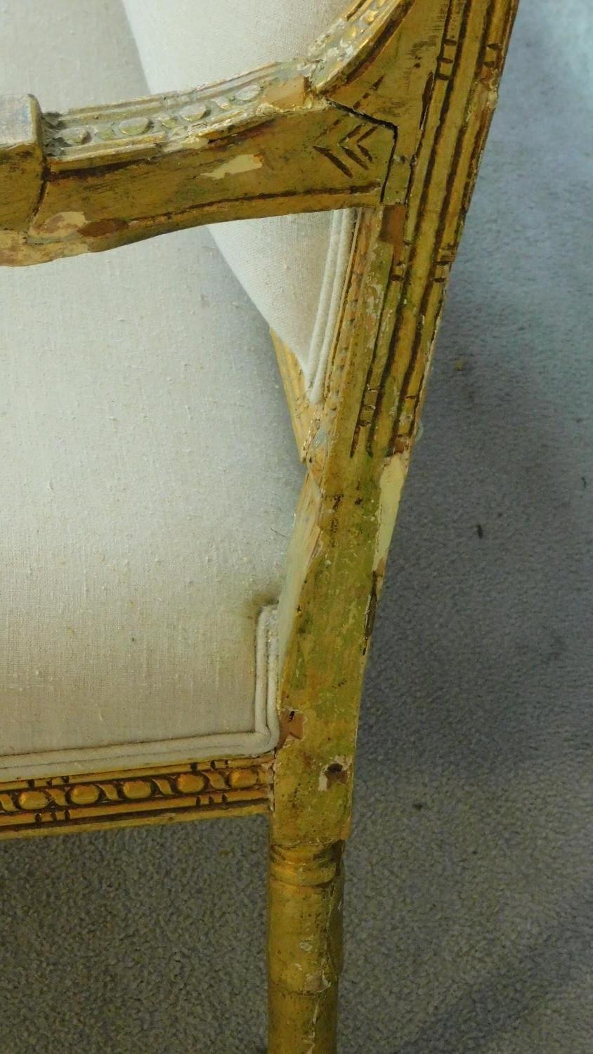 A Louis XVI style carved giltwood sofa with cream upholstery raised on turned tapering supports. H. - Image 7 of 10