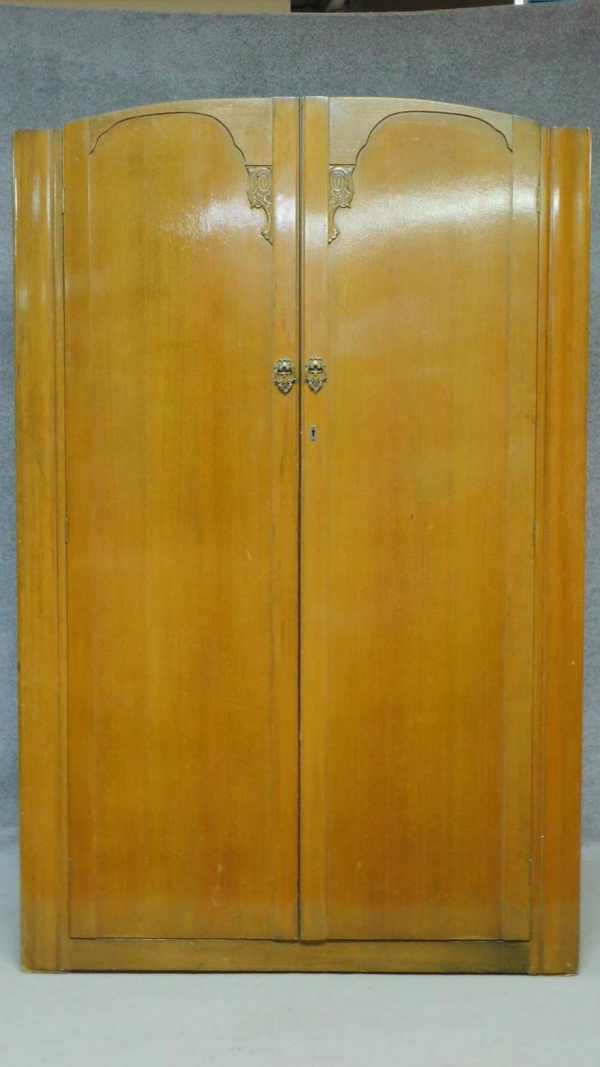 A mid 20th century light oak Art Deco style wardrobe. H.189 W.122 D.47cm